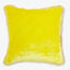 Square yellow decorative pillow with plush texture and fringe trim.