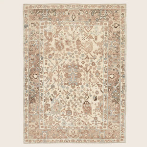 An ornate rectangular area rug featuring a symmetrical, muted design.