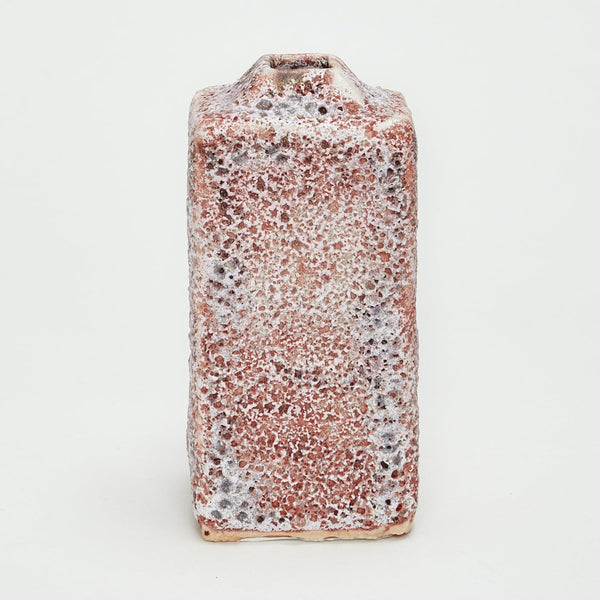 Bubbly textured ceramic bottle with a variety of hues displayed