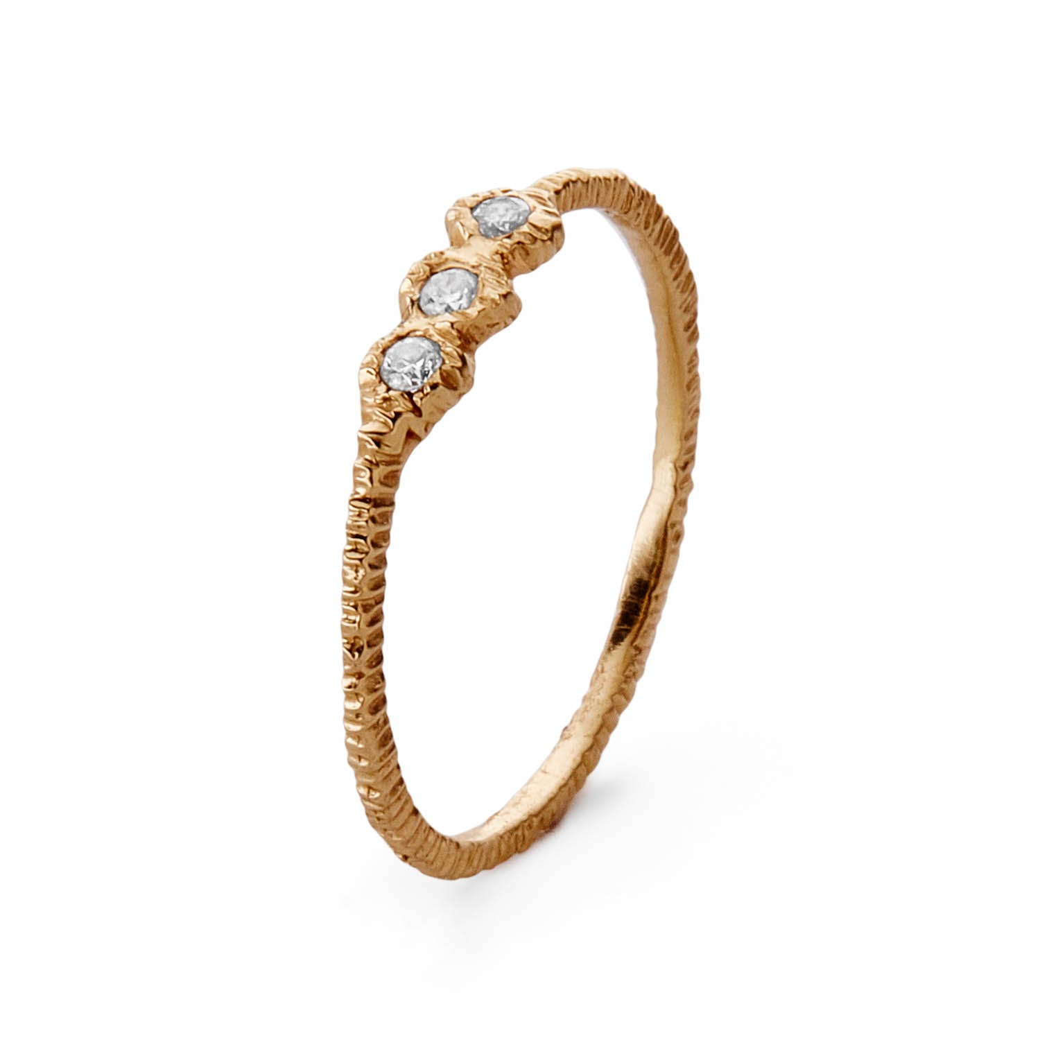 Elegant gold ring with three sparkling gemstones, perfect for special occasions.