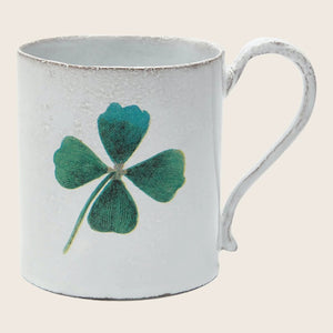 Vintage white mug with distressed finish and lucky four-leaf clover