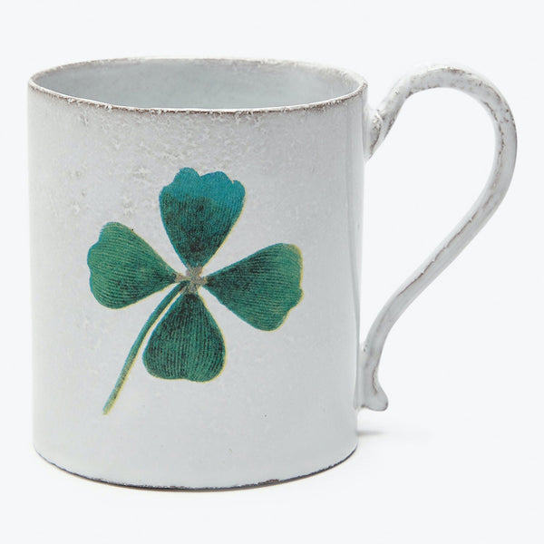 Vintage white mug with distressed finish and lucky four-leaf clover