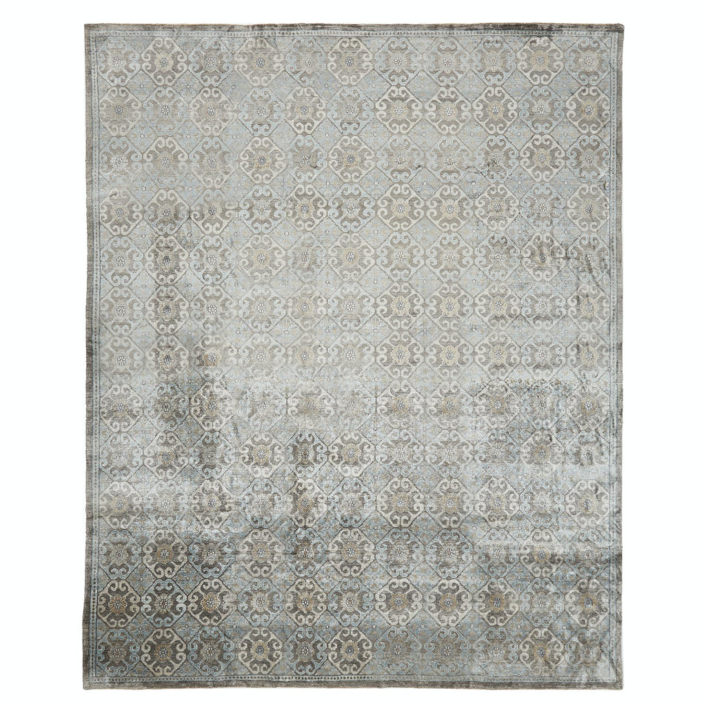 Vintage-inspired rectangular area rug with intricate faded pattern and neutral tones.