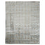 Vintage-inspired rectangular area rug with intricate faded pattern and neutral tones.