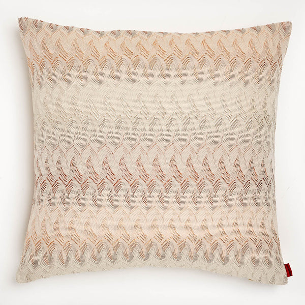 Stylish, handmade decorative pillow with wavelike pattern and gradient colors.