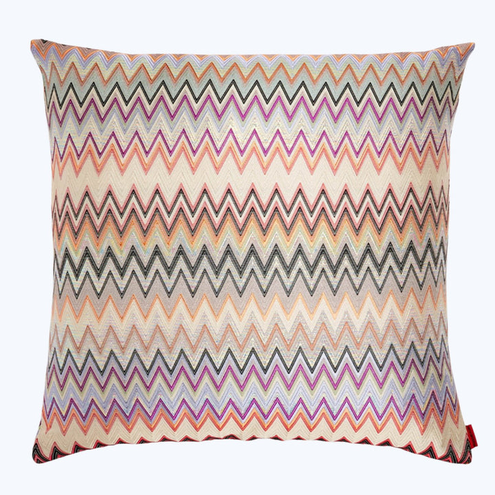 Vibrant zigzag patterned throw pillow with textured weave fabric.