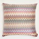 Vibrant zigzag patterned throw pillow with textured weave fabric.