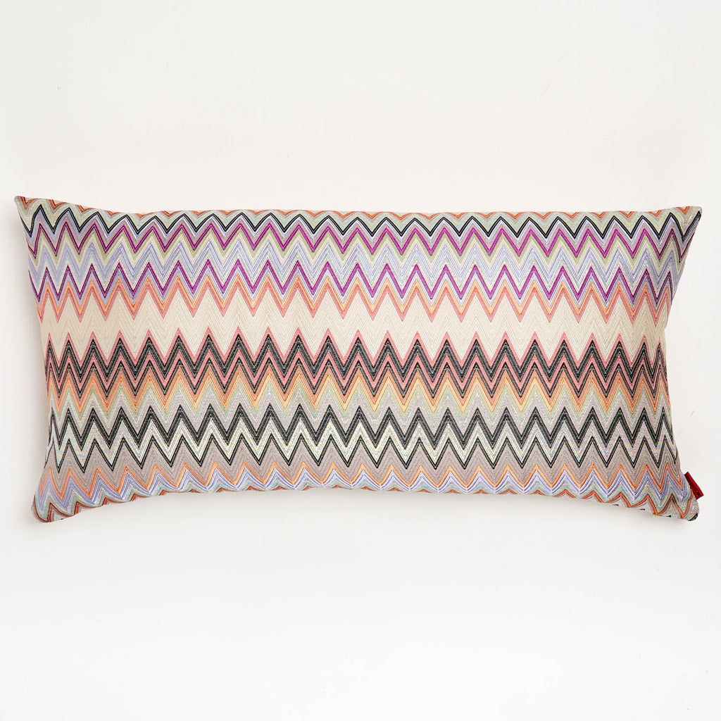 Vibrant multicolored zigzag patterned rectangular pillow with hidden zipper closure.