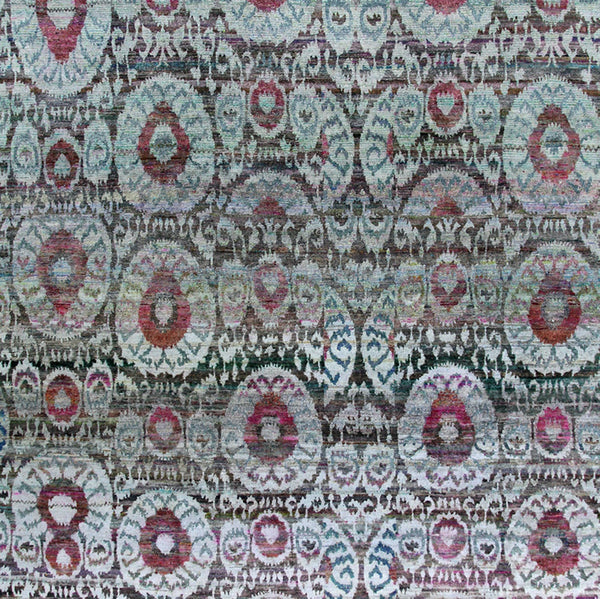 Intricate vintage-style rug tapestry with floral motifs in muted hues.