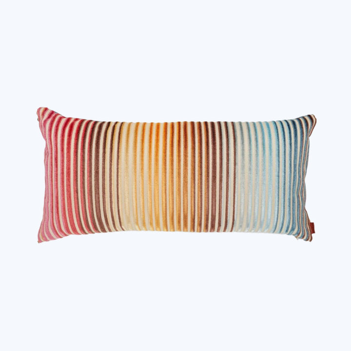 Rectangular decorative pillow with tassels in colorful gradient pattern.