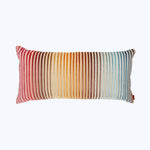 Rectangular decorative pillow with tassels in colorful gradient pattern.