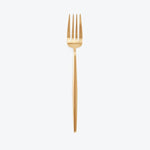 Gold fork with four tines and sleek handle on white background.