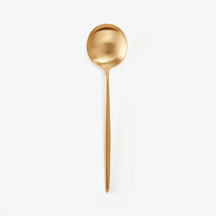 Golden spoon with modern design and luxurious matte finish isolated.