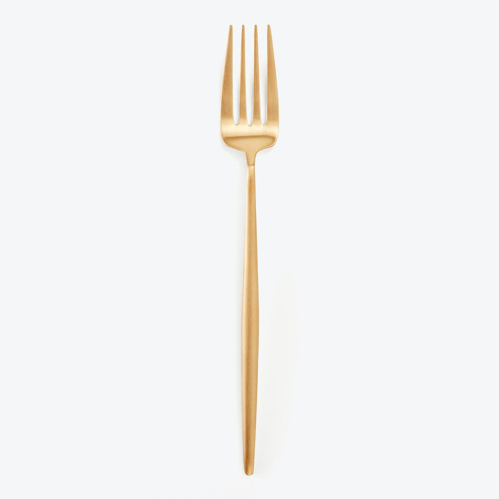 Golden fork with four tines on a white background.