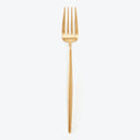 Golden fork with four tines on a white background.