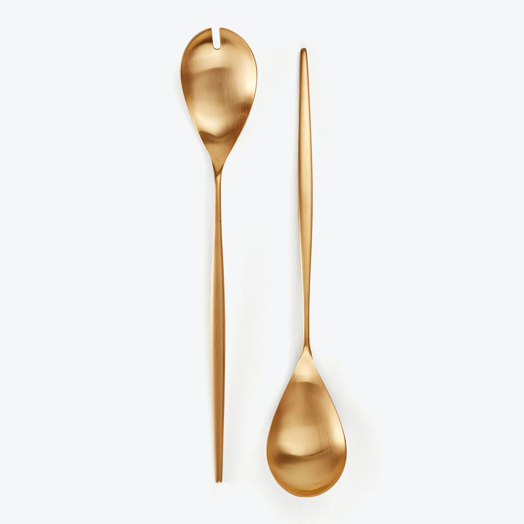 Two modern, golden utensils - slotted and serving spoons.