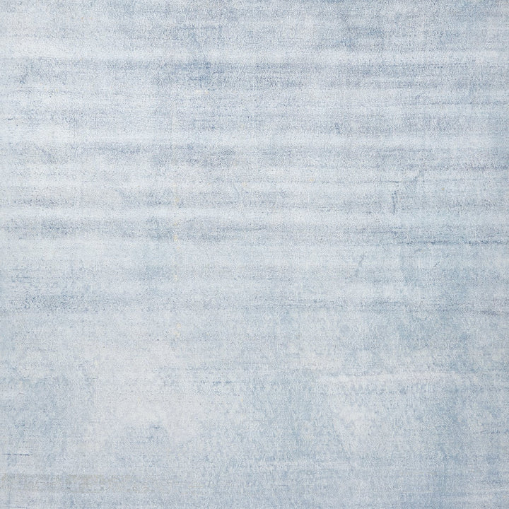 Textured surface with horizontal striation pattern, resembling washed-out denim.