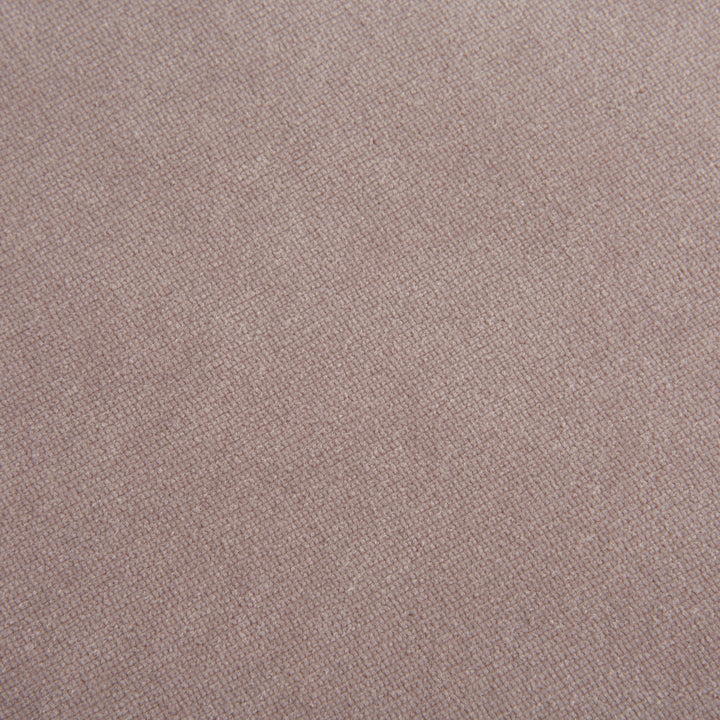 Close-up of textured fabric with tight weave, muted pink color.