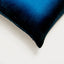 Close-up of a plush blue pillow with ombré effect