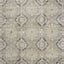 Intricate floral and scroll pattern on neutral fabric for interiors.