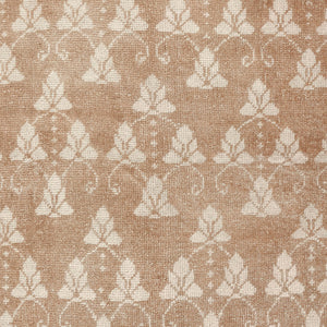 Rectangular rug with elegant floral pattern in light brown/beige background. - hover