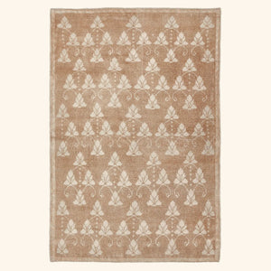 Rectangular rug with elegant floral pattern in light brown/beige background.
