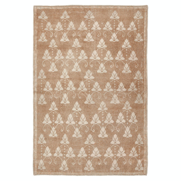 Rectangular rug with elegant floral pattern in light brown/beige background.