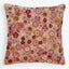 Decorative pillow with embroidered floral pattern adds warmth and visual interest.