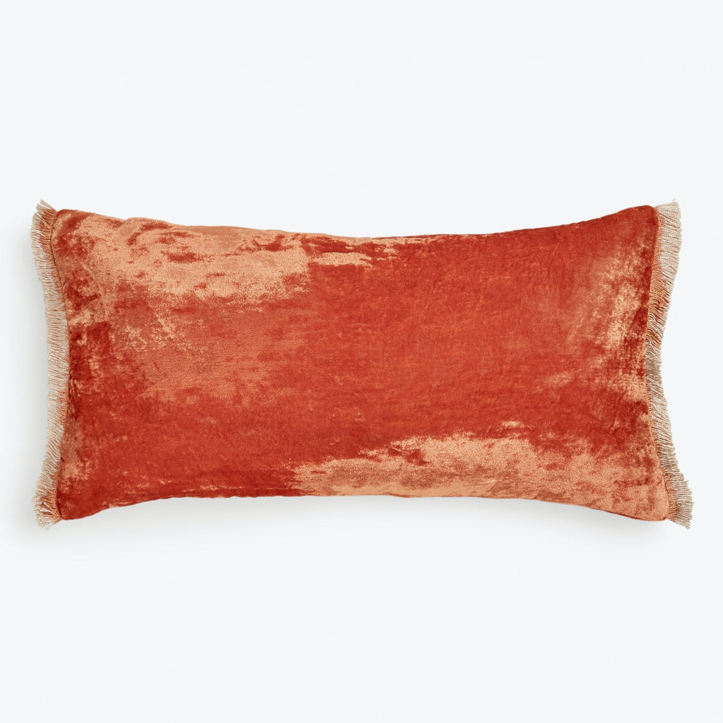 Rich velvet rectangular decorative pillow in burnt orange color.