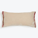 Rectangular beige pillow with burgundy fringe on a white background.