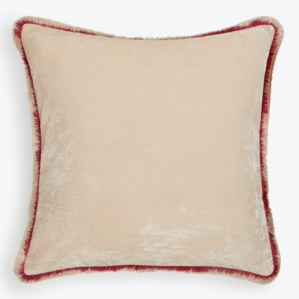 Square velvet pillow with beige tone and reddish-brown trim.