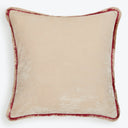 Square velvet pillow with beige tone and reddish-brown trim.