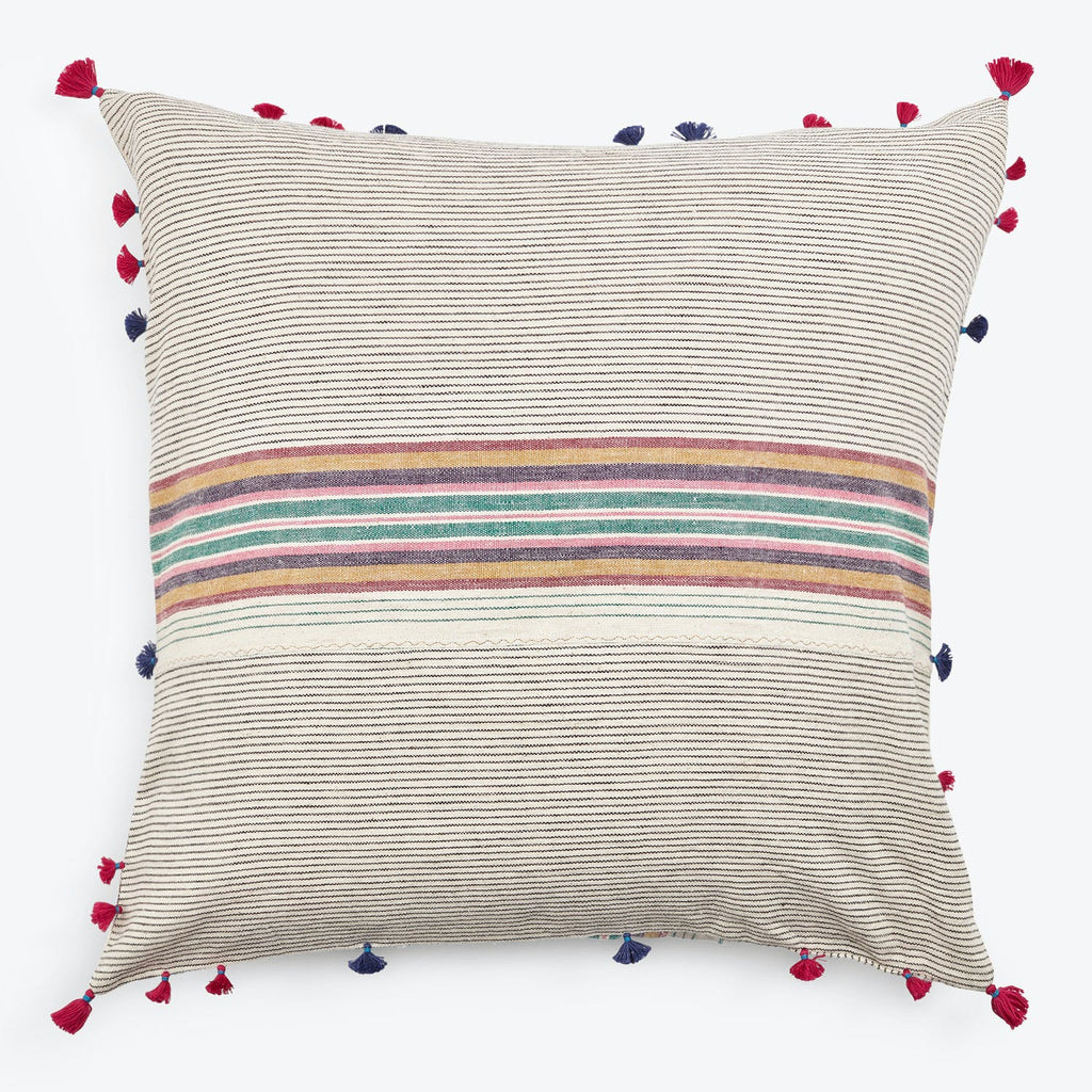 Bohemian throw pillow with textured fabric, colorful stripes, and tassels.