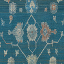 Intricate, symmetrical floral pattern in rich colors on woven textile.