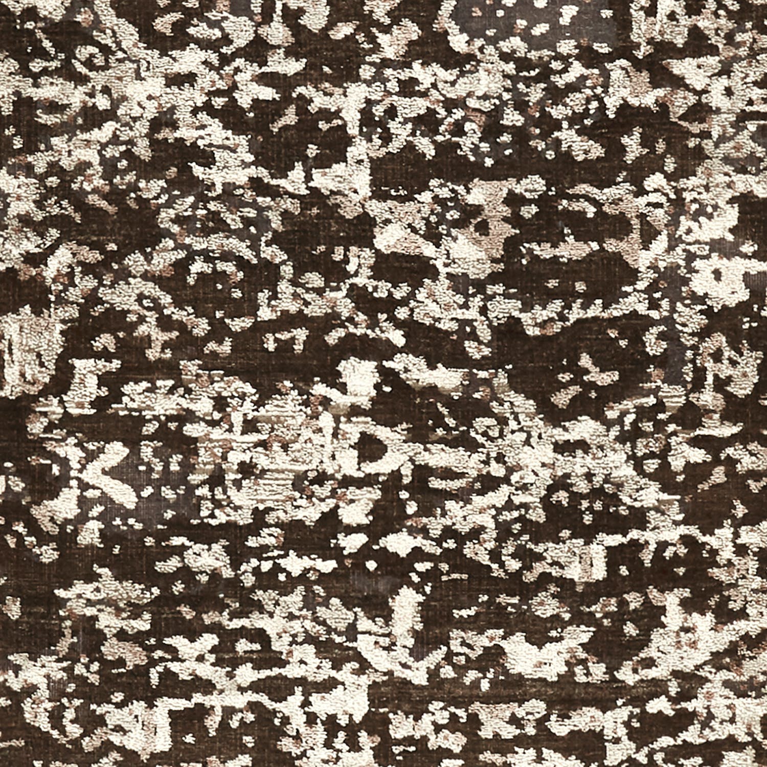 Abstract splatter-like design in dark brown with beige markings.