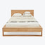 Neatly designed wooden bed with minimalist aesthetic and decorative elements.