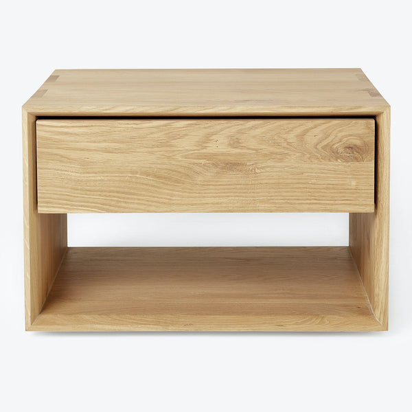 Modern wooden nightstand with minimalist design and push-to-open drawer.