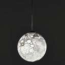 Modern pendant light with intricate network pattern, creating captivating shadows.