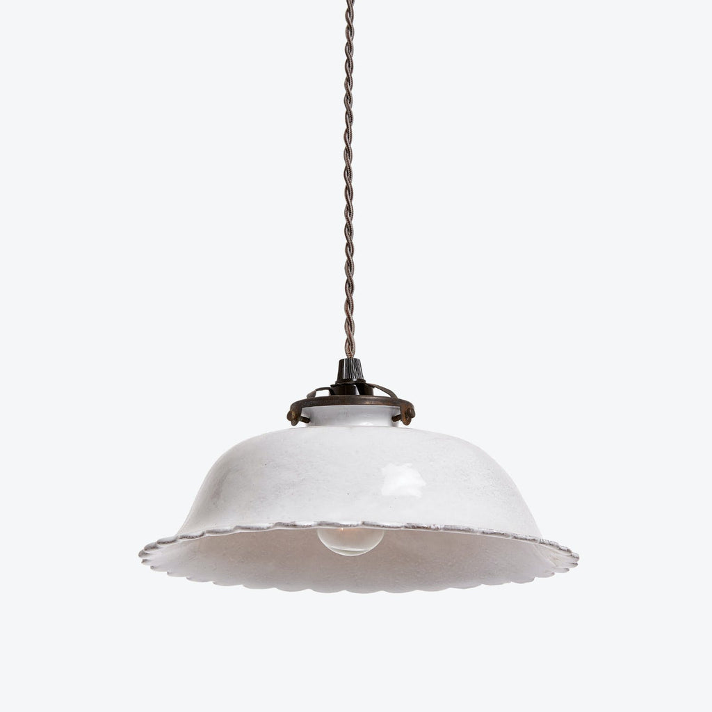 Minimalistic pendant light with white enamel shade and industrial fittings.