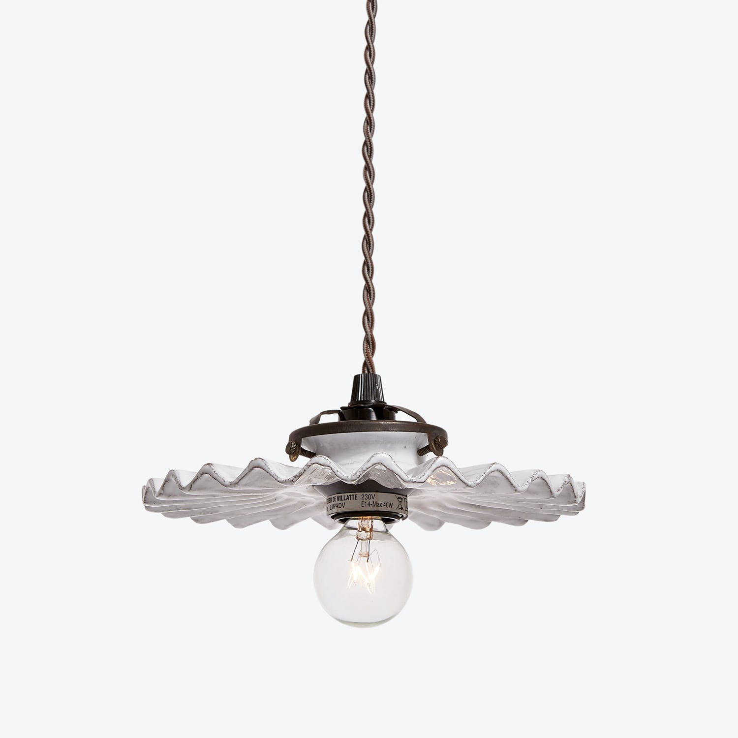 Elegant pendant light fixture with vintage-inspired glass shade and warm glow.
