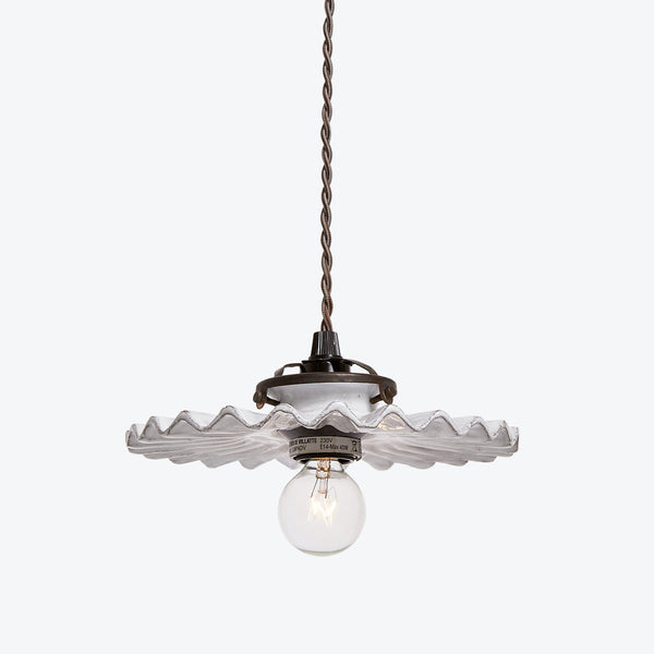 Elegant pendant light fixture with vintage-inspired glass shade and warm glow.