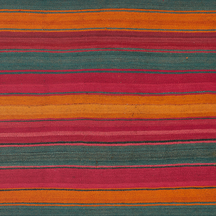 Vibrant and textured striped fabric showcases a beautiful color palette.