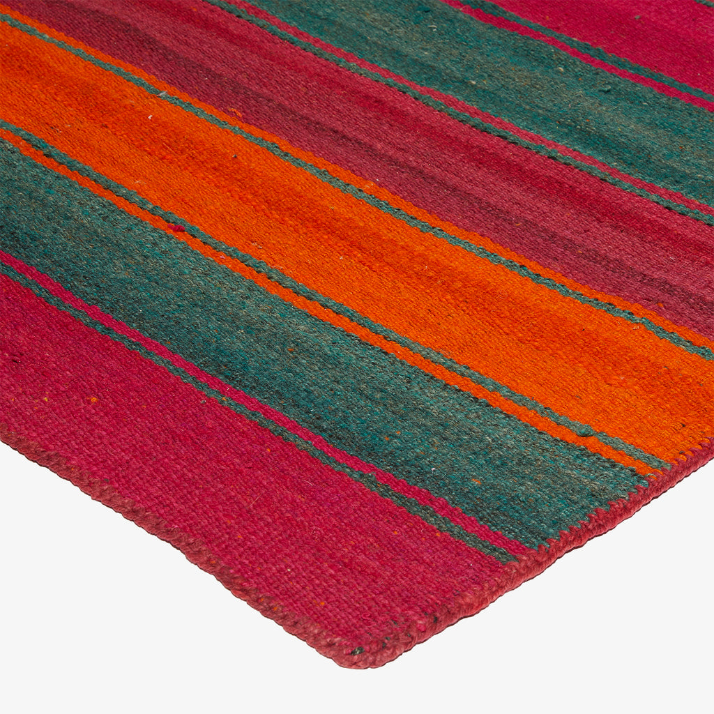 Close-up view of a colorful striped textile with vibrant stripes.