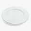 Minimalist white plate with a subtle raised edge and center depression.