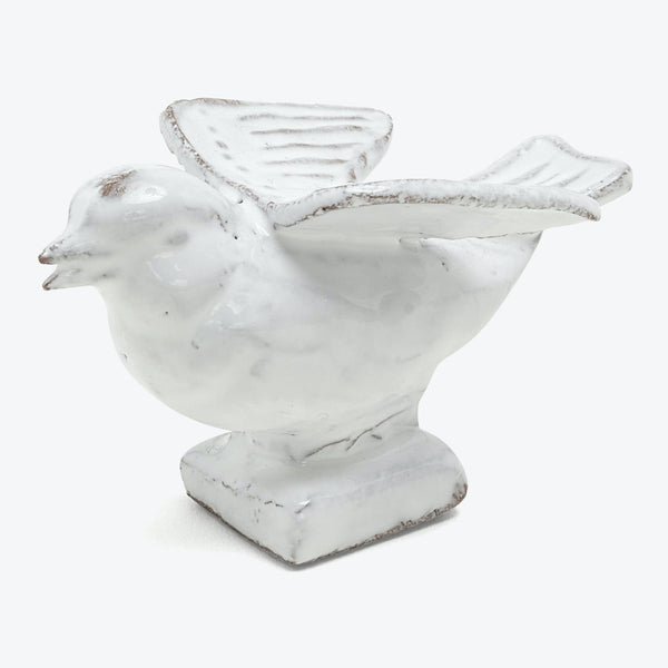 Contemporary marble sculpture of a plump chicken ready to fly.