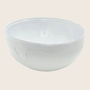Minimalist ceramic bowl in light gray/white with glossy finish.