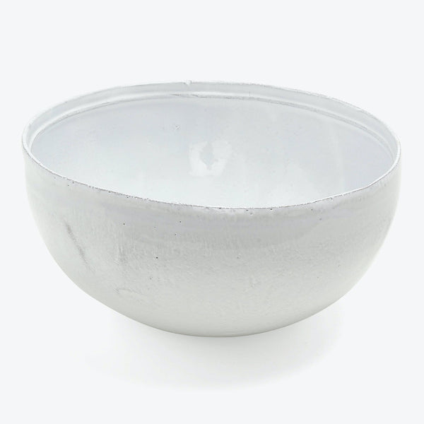 Minimalist ceramic bowl in light gray/white with glossy finish.