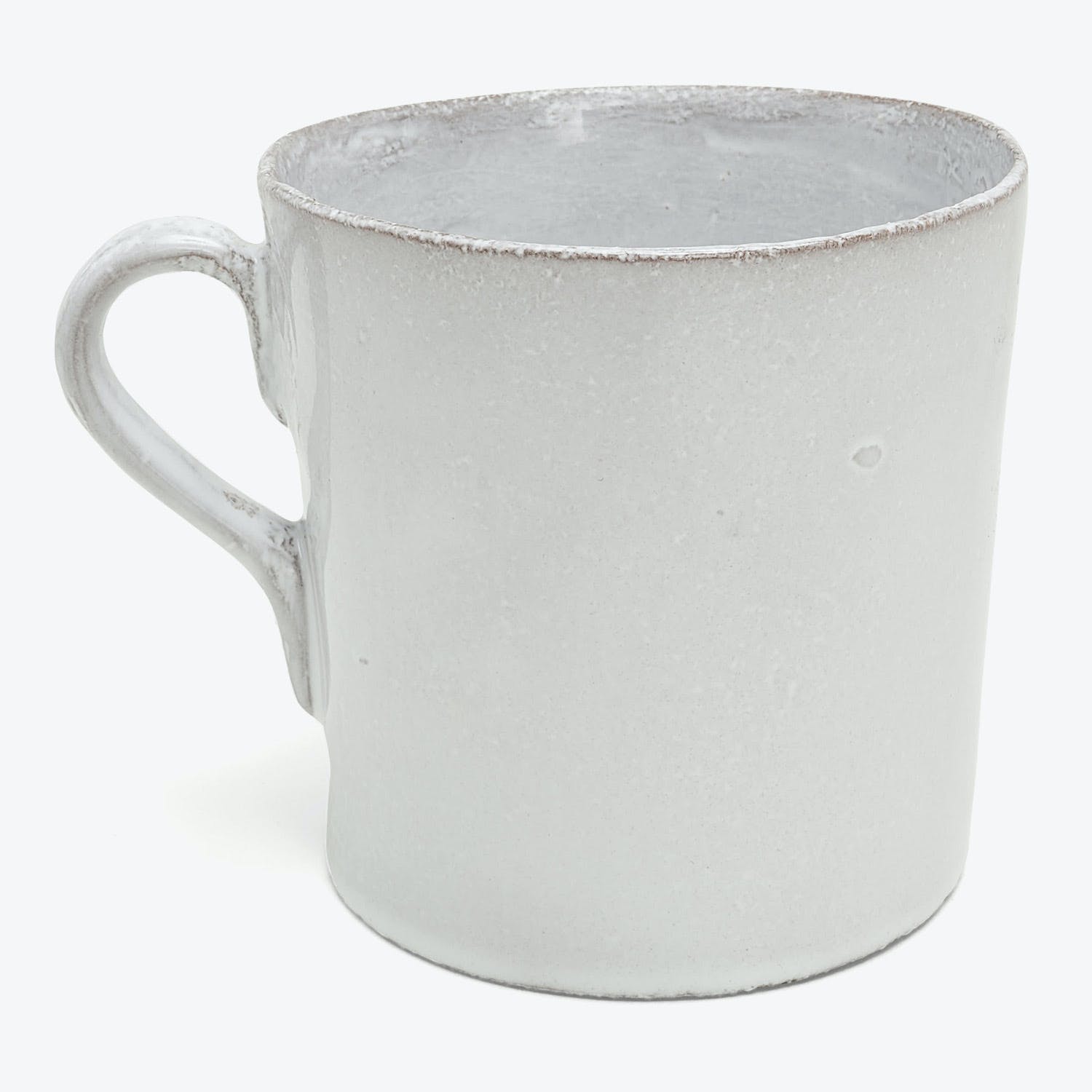 Handcrafted ceramic mug with rustic whitewash finish and textured surface