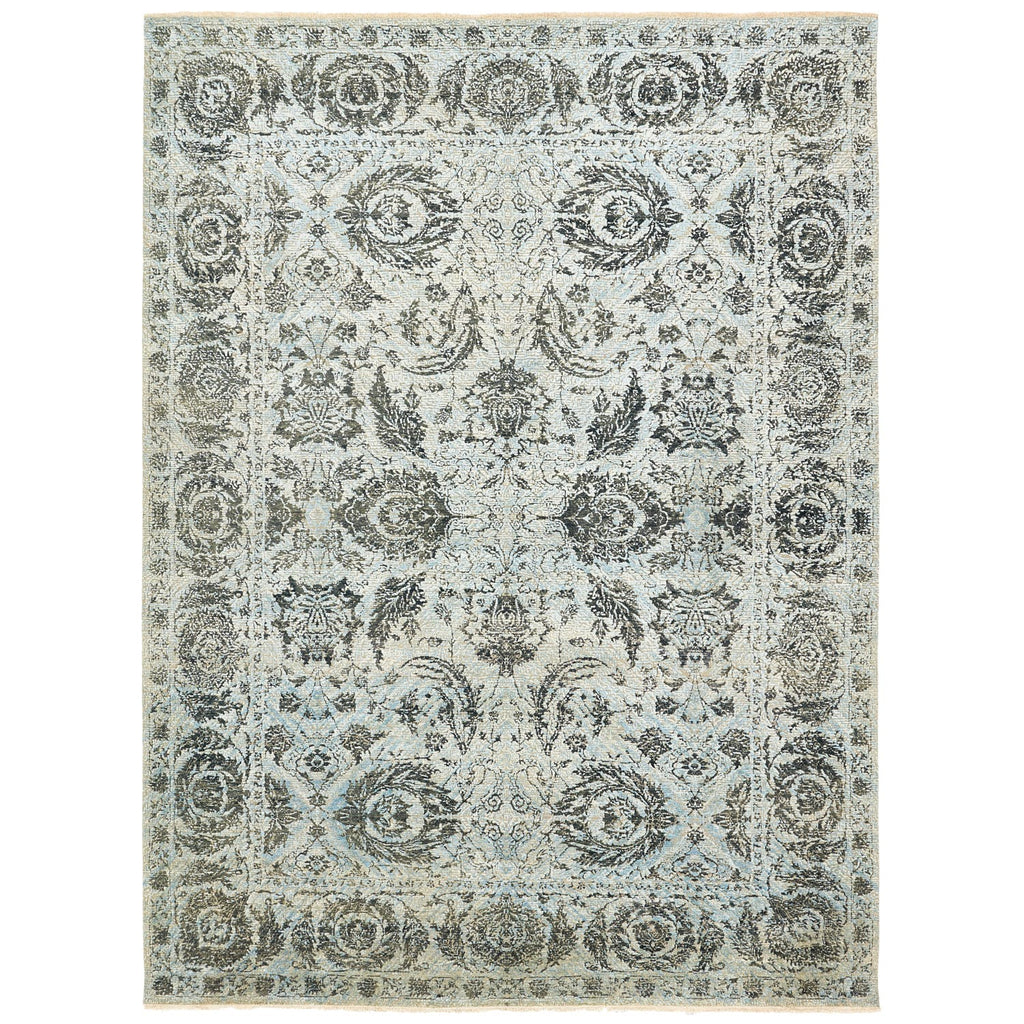 Intricately patterned ornate rug with muted vintage color palette.