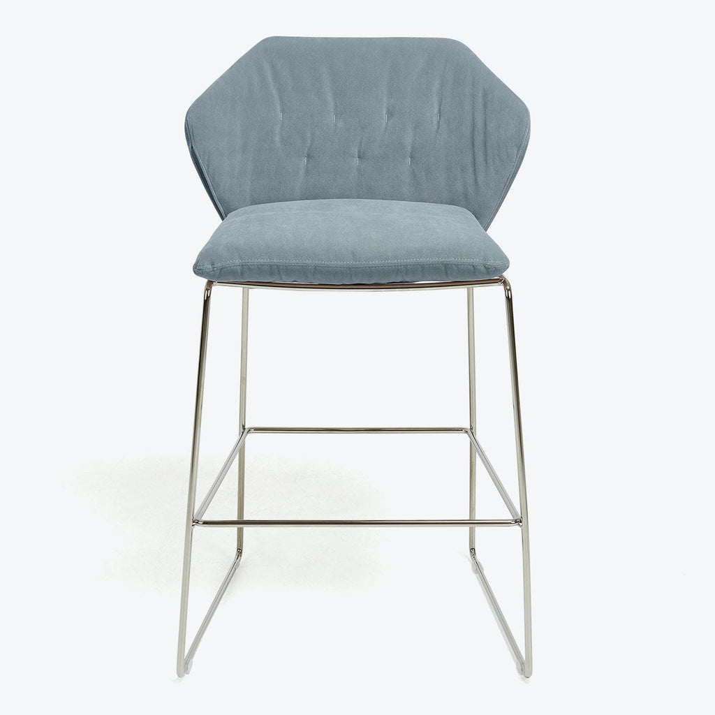 Modern bar stool with chrome frame and tufted light blue upholstery.